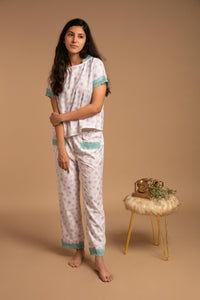 Olivia pyjama suit with floral pattern and delicate lace details.