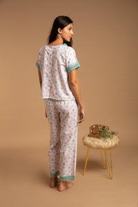 Olivia Pyjama Suit with floral pattern and lace trim, stylish loungewear.