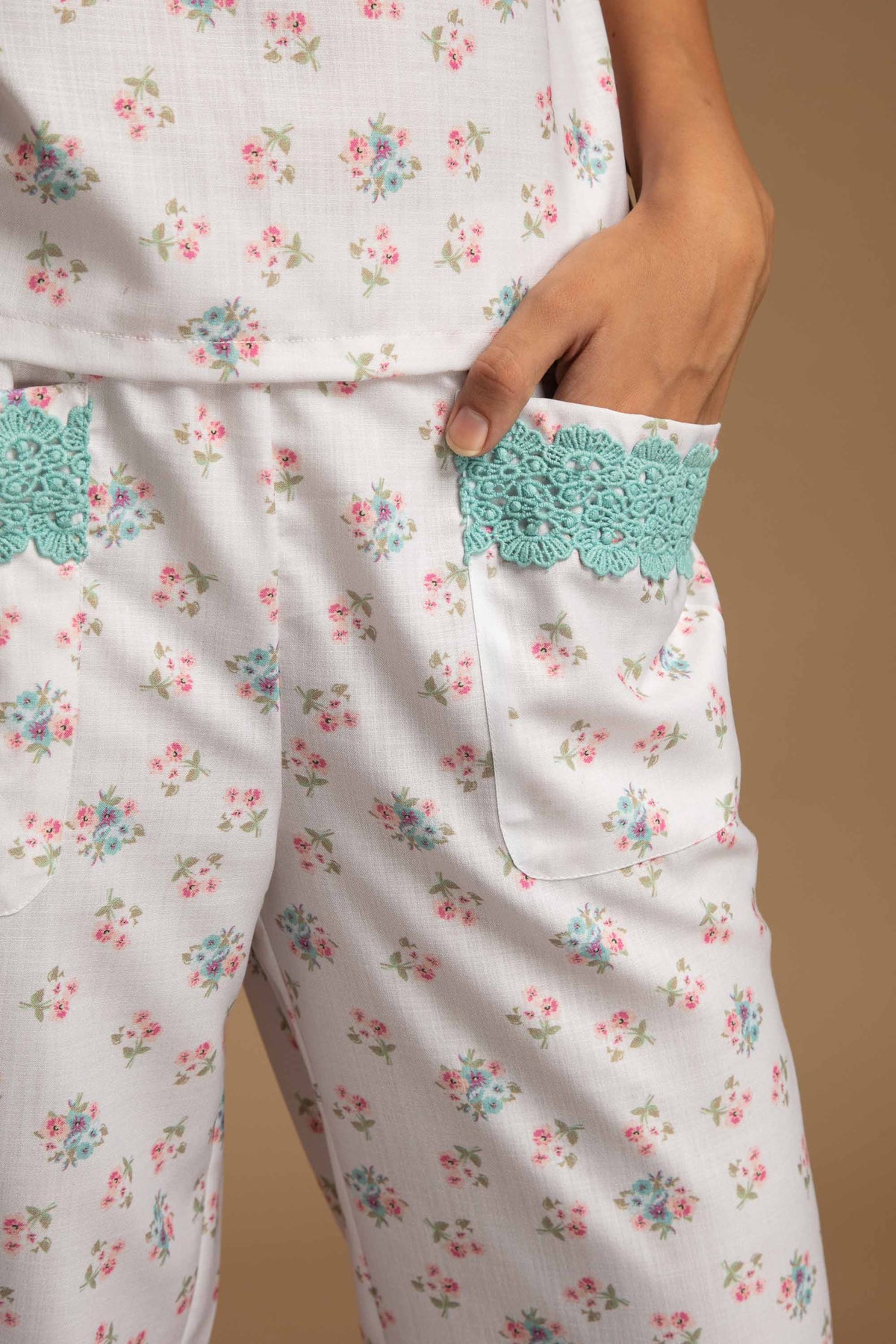 Olivia Pyjama Suit with floral design and lace pockets.