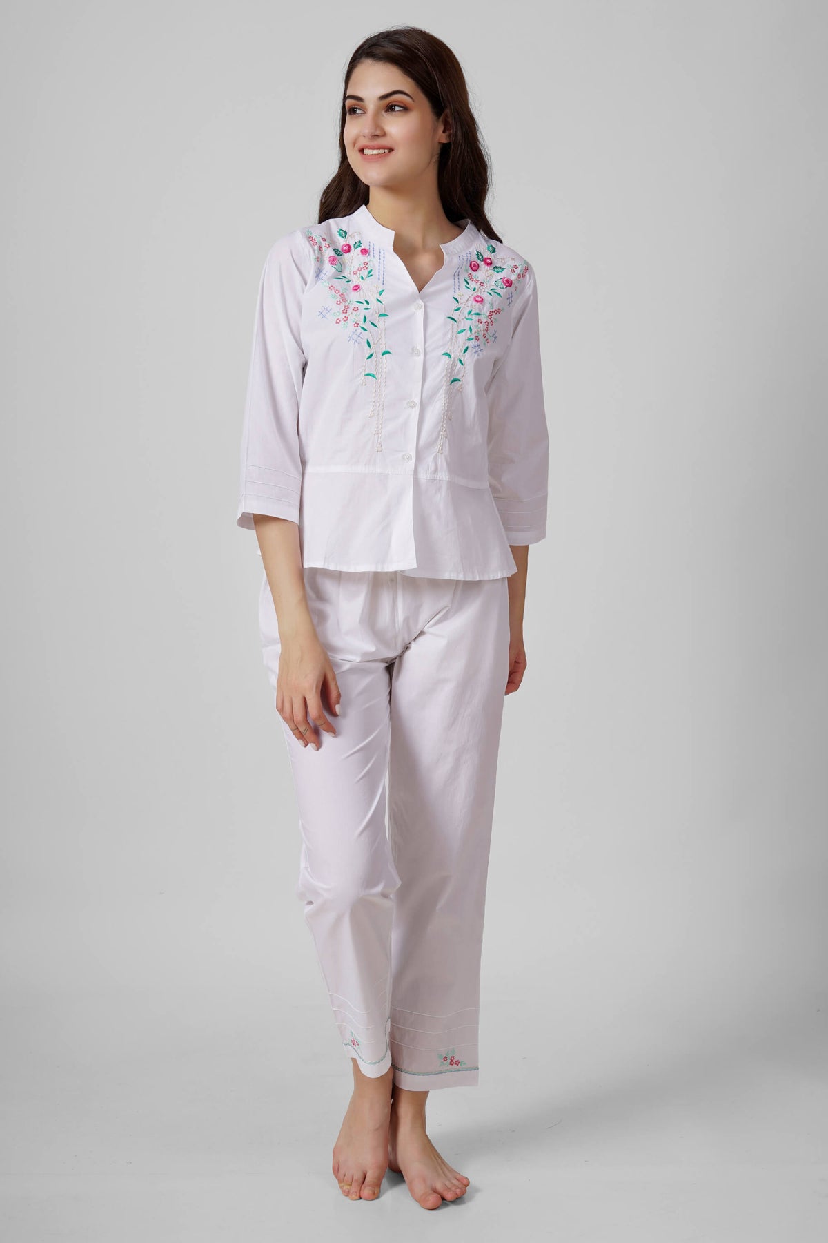 Nora pyjama suit with floral embroidery and elegant fit.