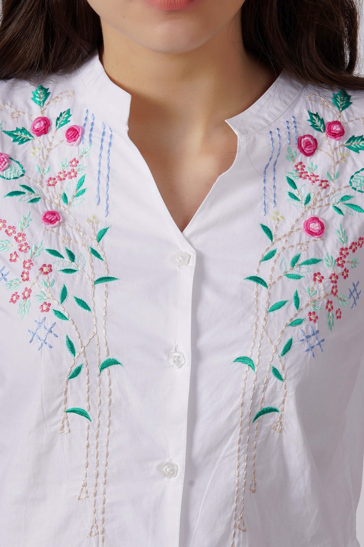 Nora Pyjama Suit with floral embroidery detail on white fabric.