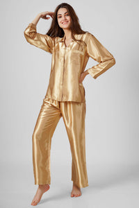 Elegant gold satin pyjama suit for stylish comfort and relaxation.