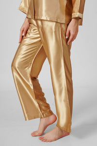 Eden-G golden pyjama suit featuring luxurious satin fabric and elegant design.