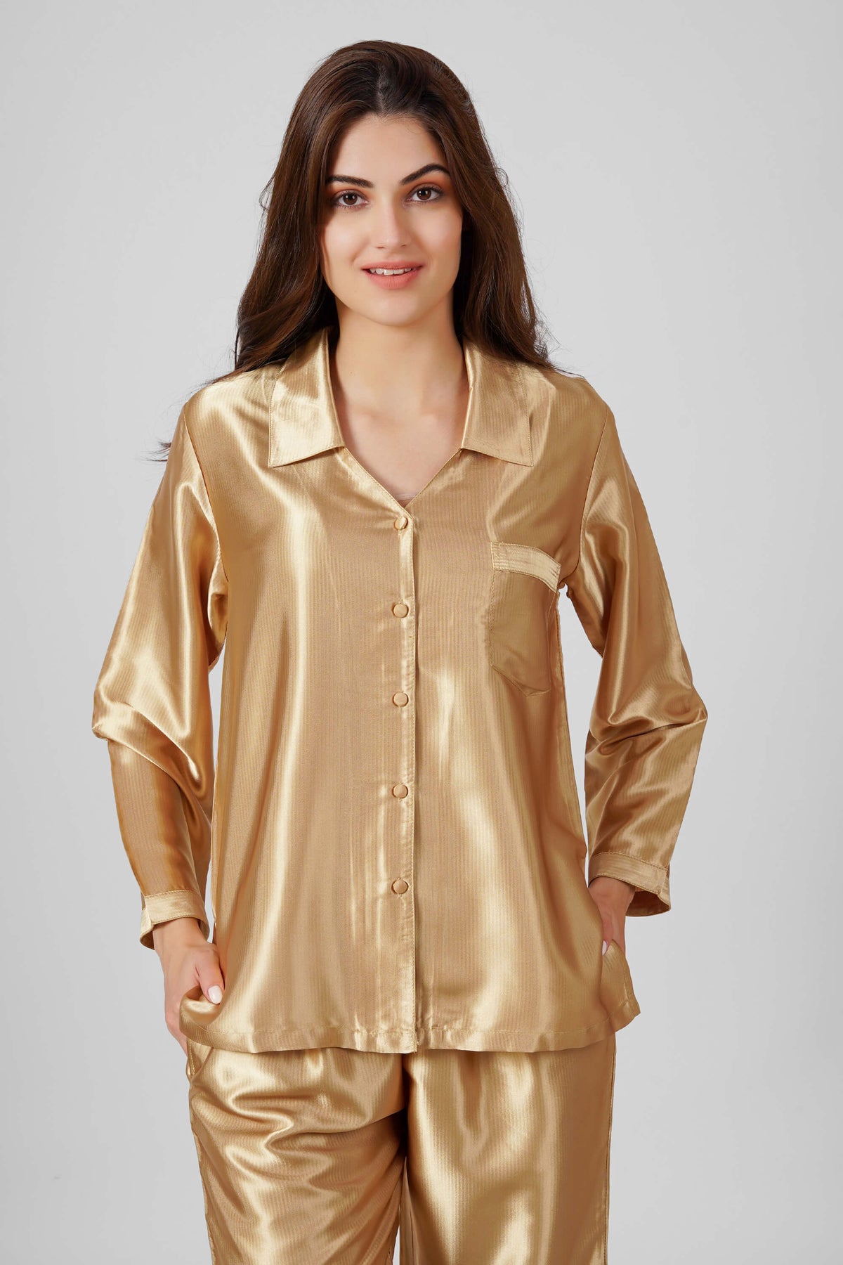 Elegant gold satin pyjama suit for women, stylish and comfortable.