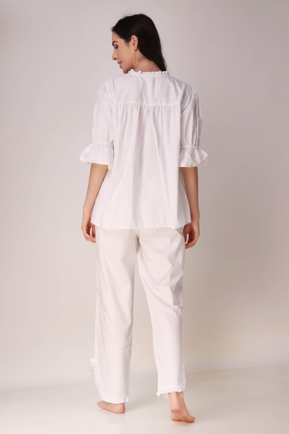 Elegant white Trudy Pyjama Suit, featuring puff sleeves and relaxed fit.