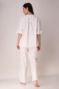 Elegant white Trudy Pyjama Suit, featuring puff sleeves and relaxed fit.