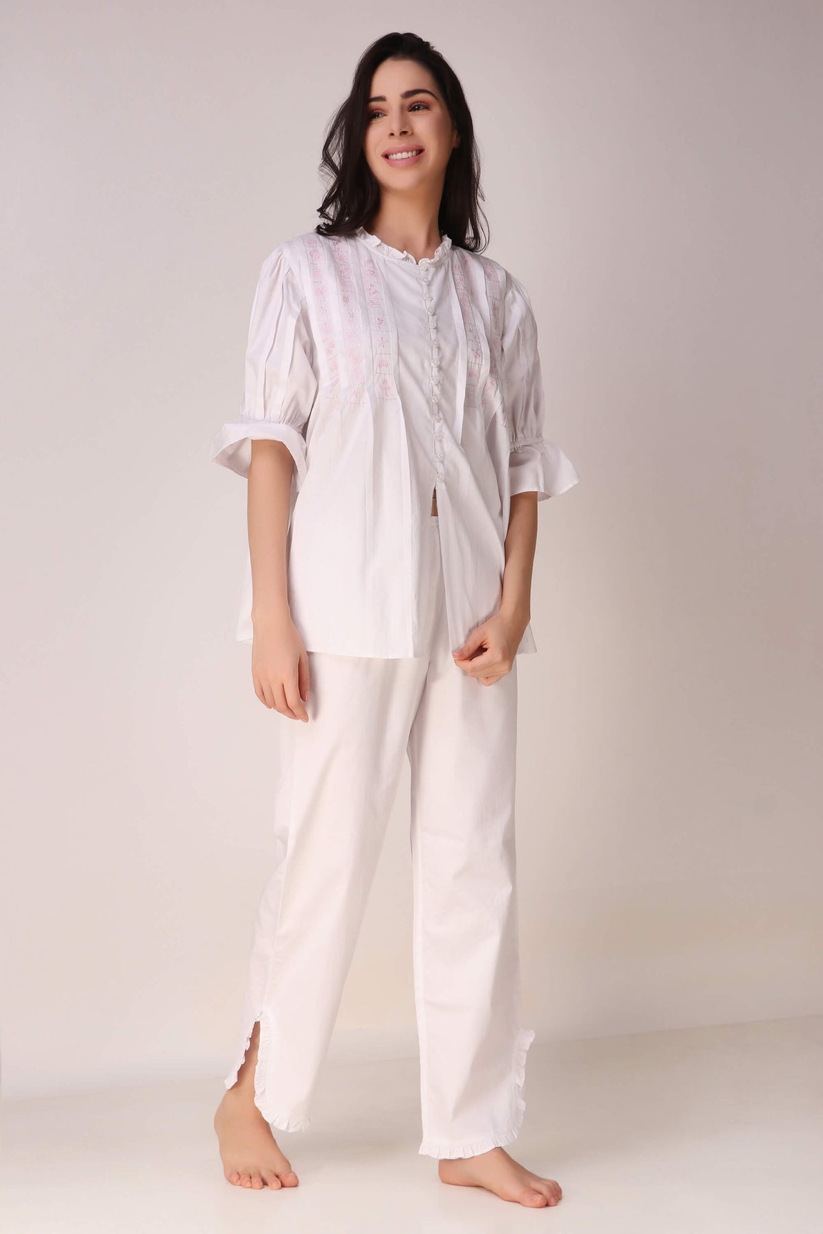 Elegant white pyjama suit for comfortable lounging and sleep.