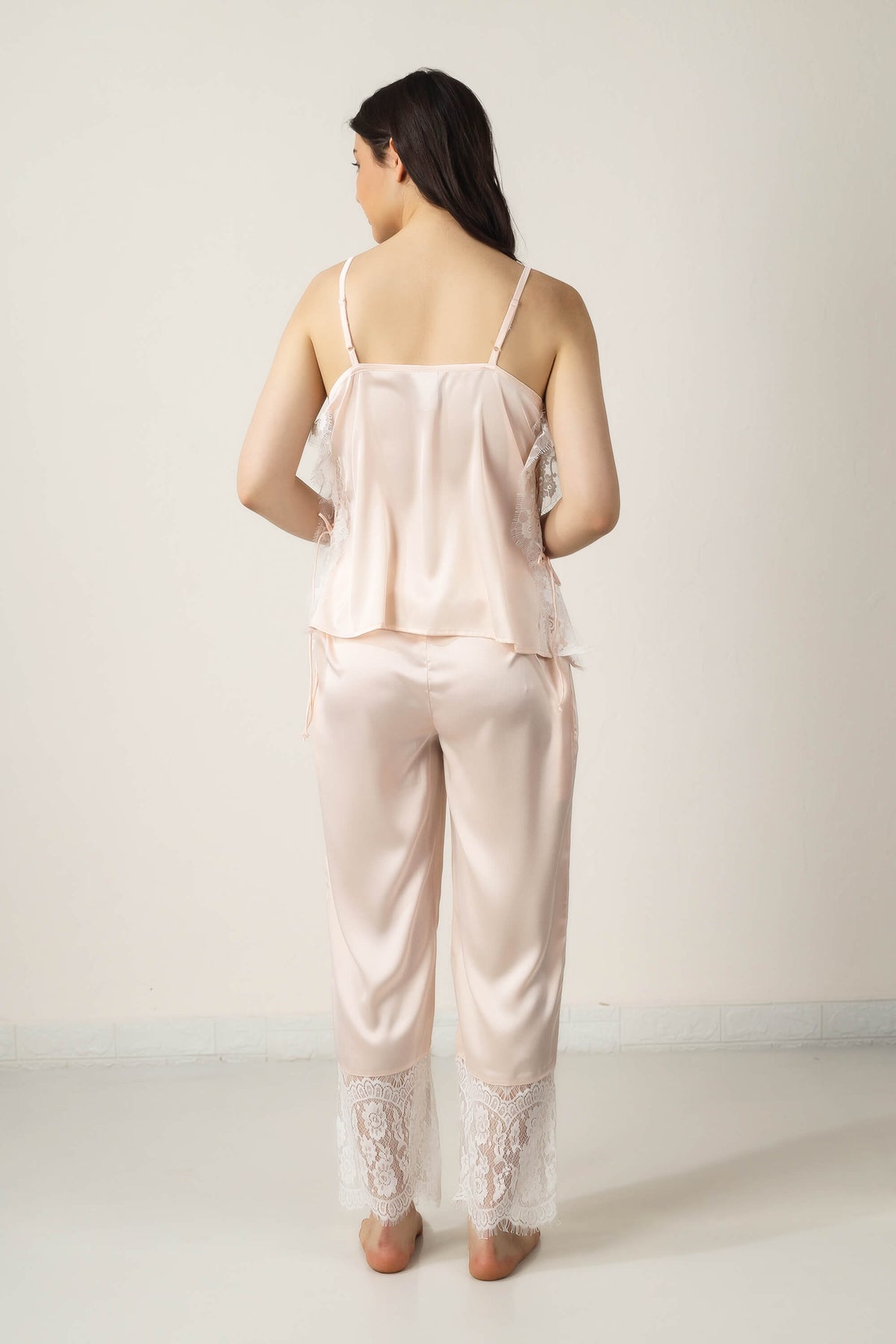 Tina Pyjama Suit in soft pink satin with lace detailing.