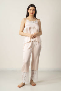 Elegant pink satin pyjama suit with lace detailing for women.