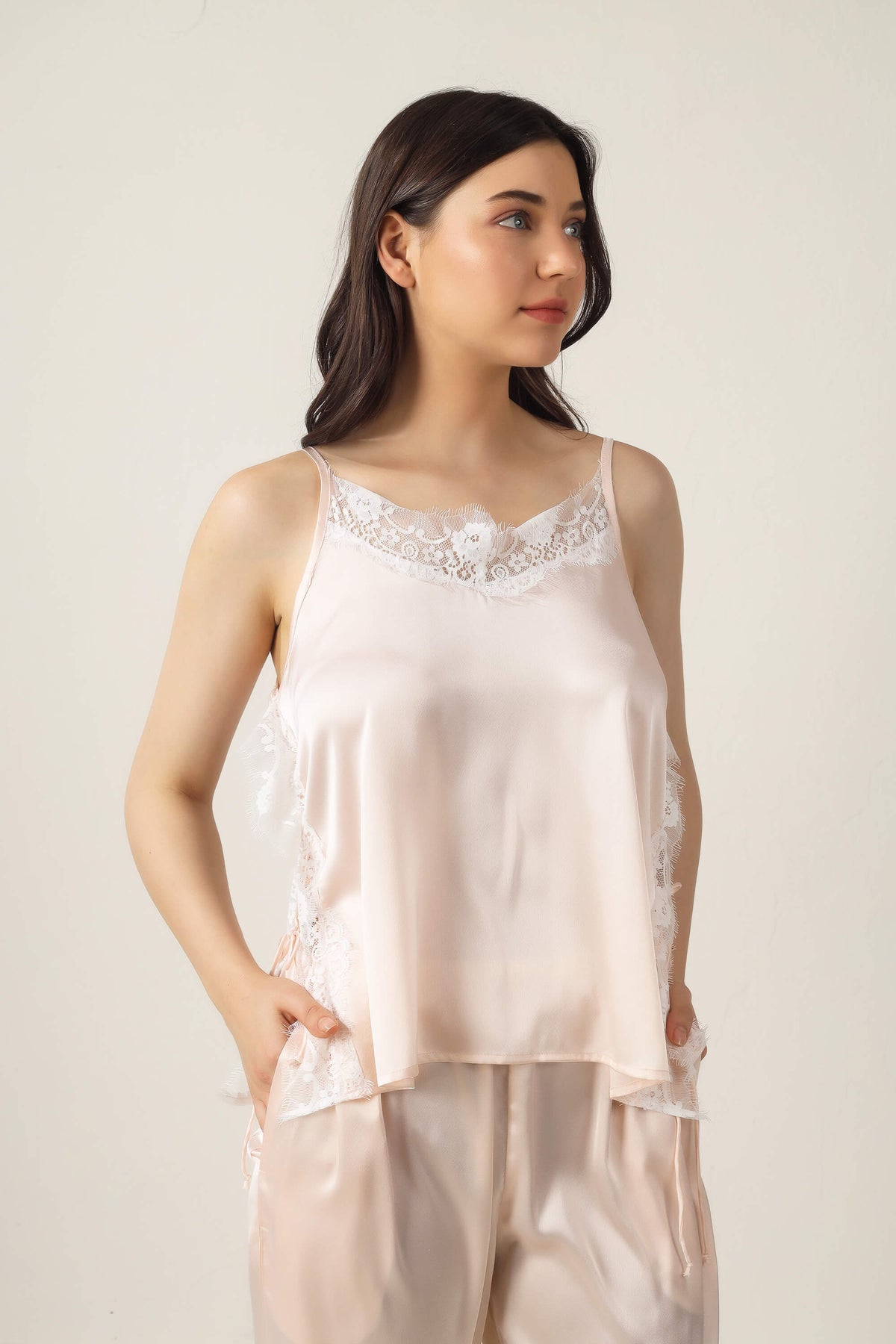 Tina Pyjama Suit featuring elegant lace-trimmed silk top and pants.