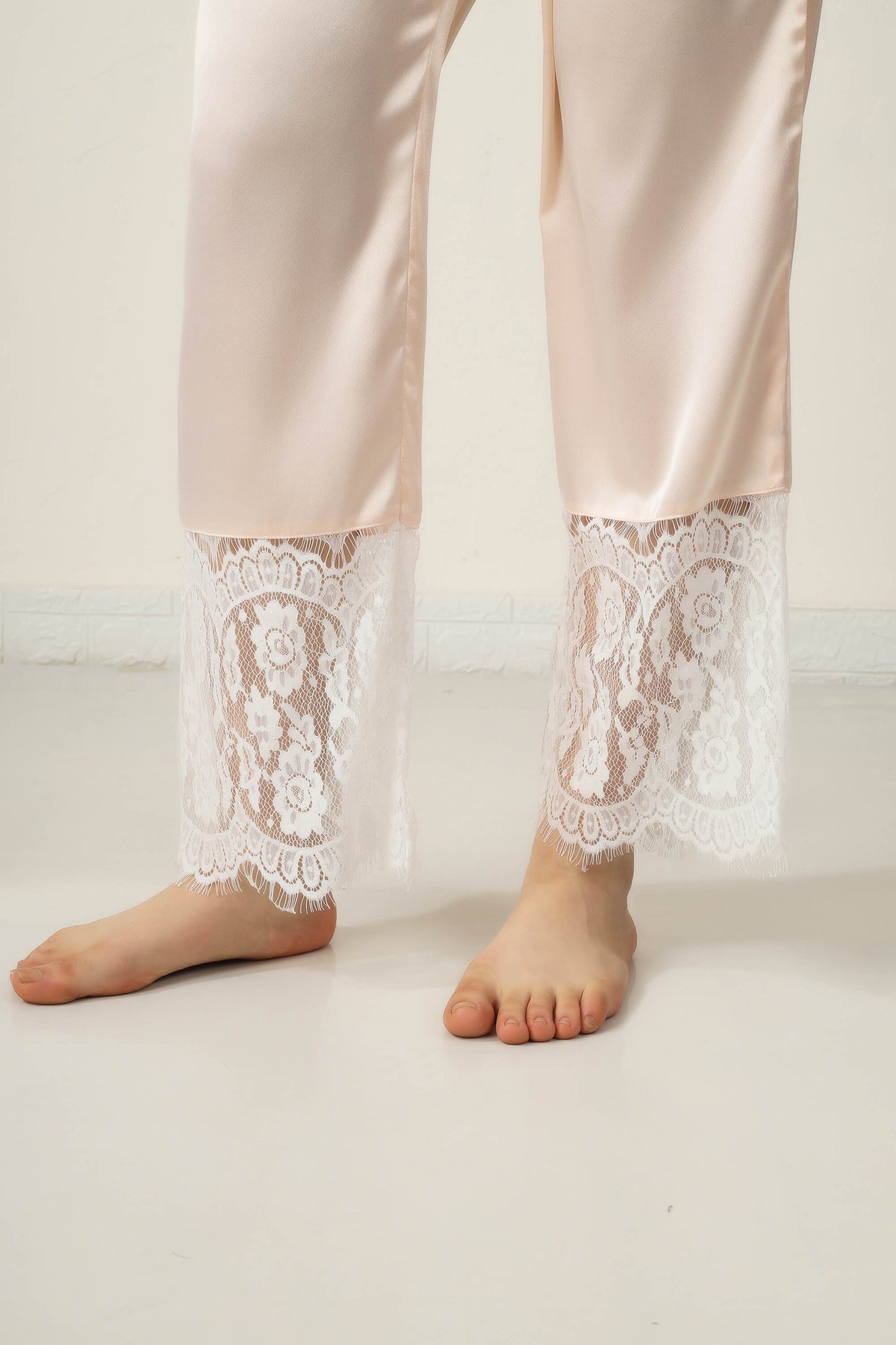 Elegant lace-trimmed Tina Pyjama Suit for stylish comfort at home.