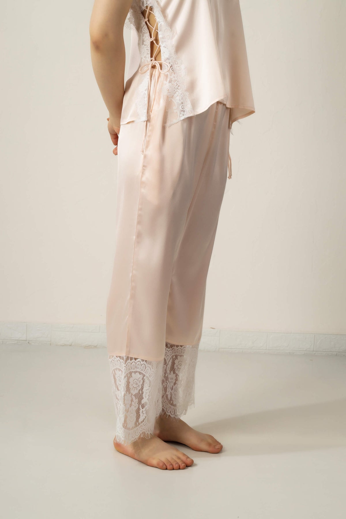 Elegant Tina Pyjama Suit with lace detailing and soft satin fabric.