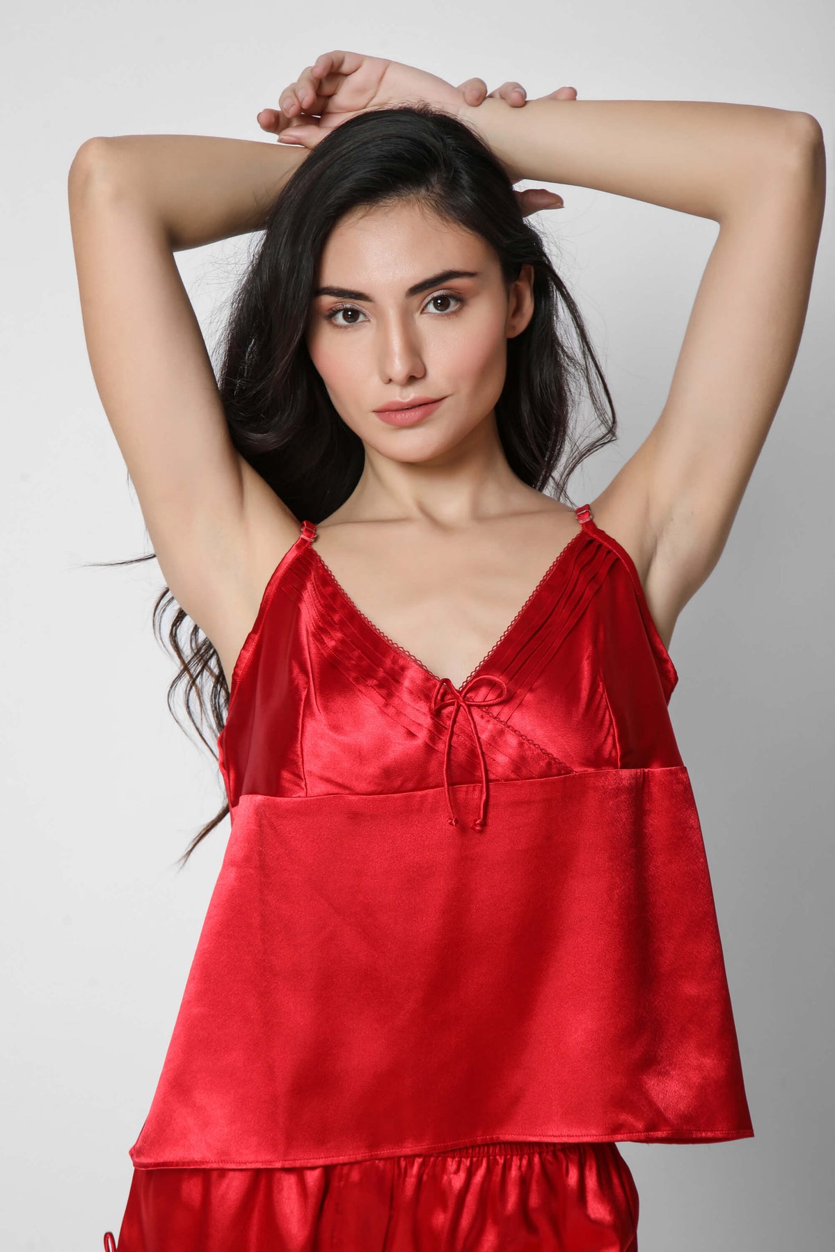 Elegant red satin camisole and shorts set for women.