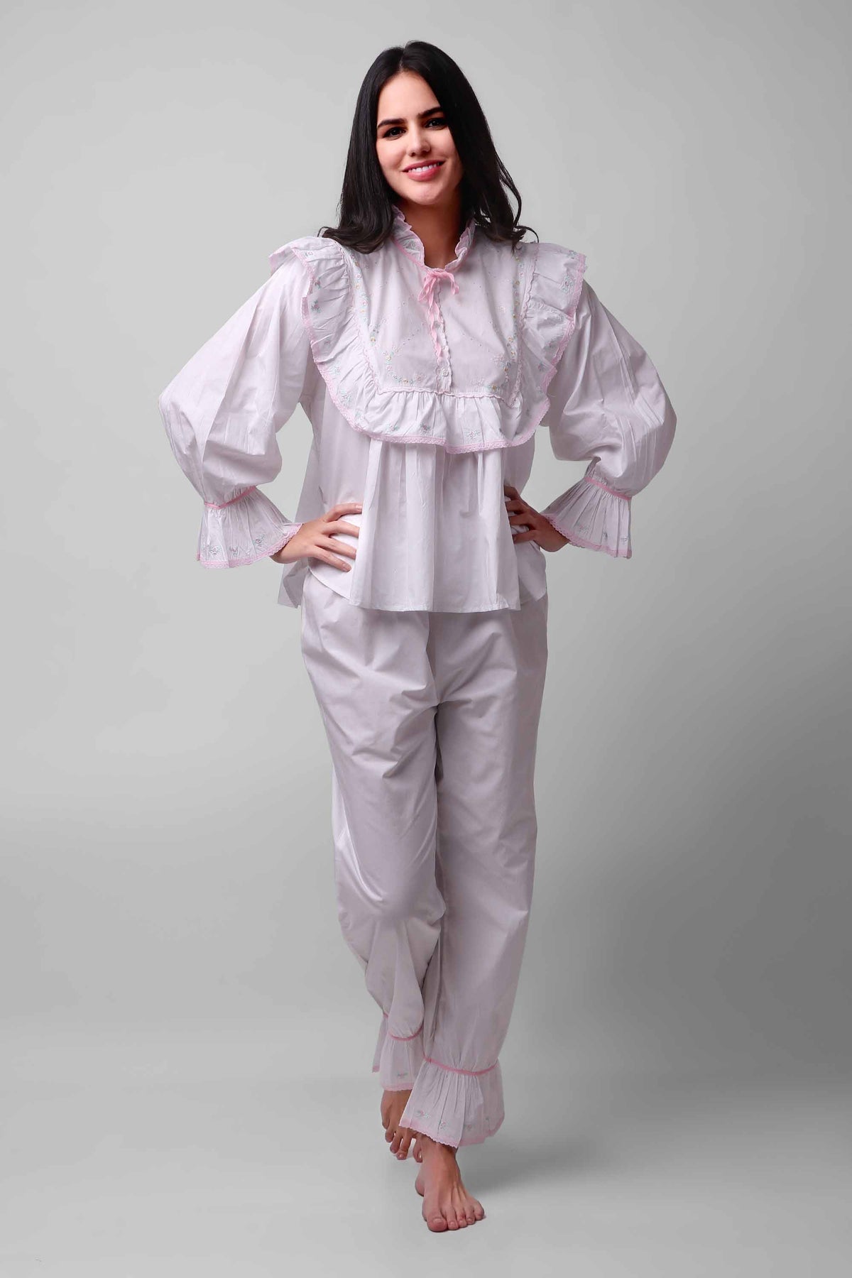 Mary Pyjama Suit in white with frilled details and relaxed fit.