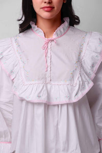 Mary Pyjama Suit with floral embroidery and pink accents.