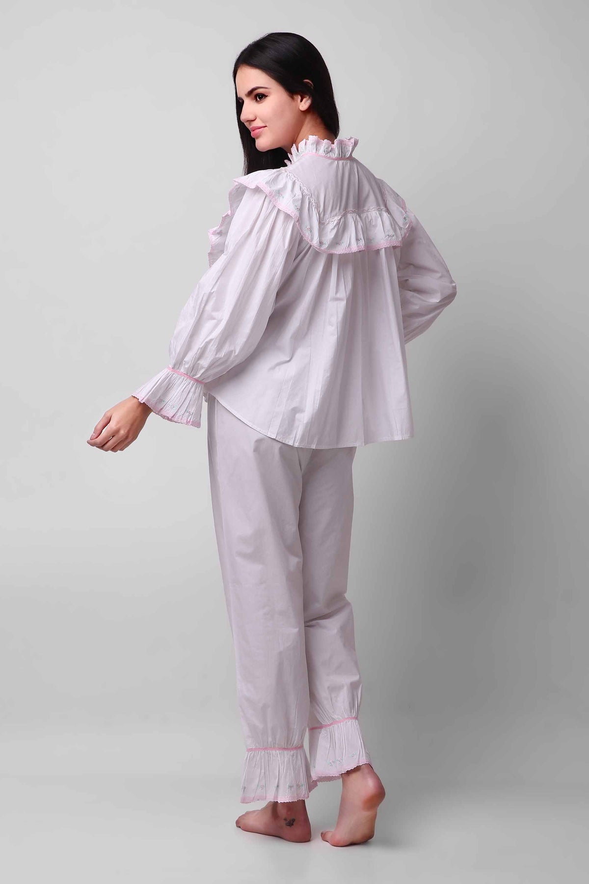 Mary Pyjama Suit featuring ruffled collar and cuff detail, stylish loungewear.