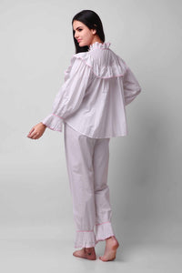 Mary Pyjama Suit featuring ruffled collar and cuff detail, stylish loungewear.