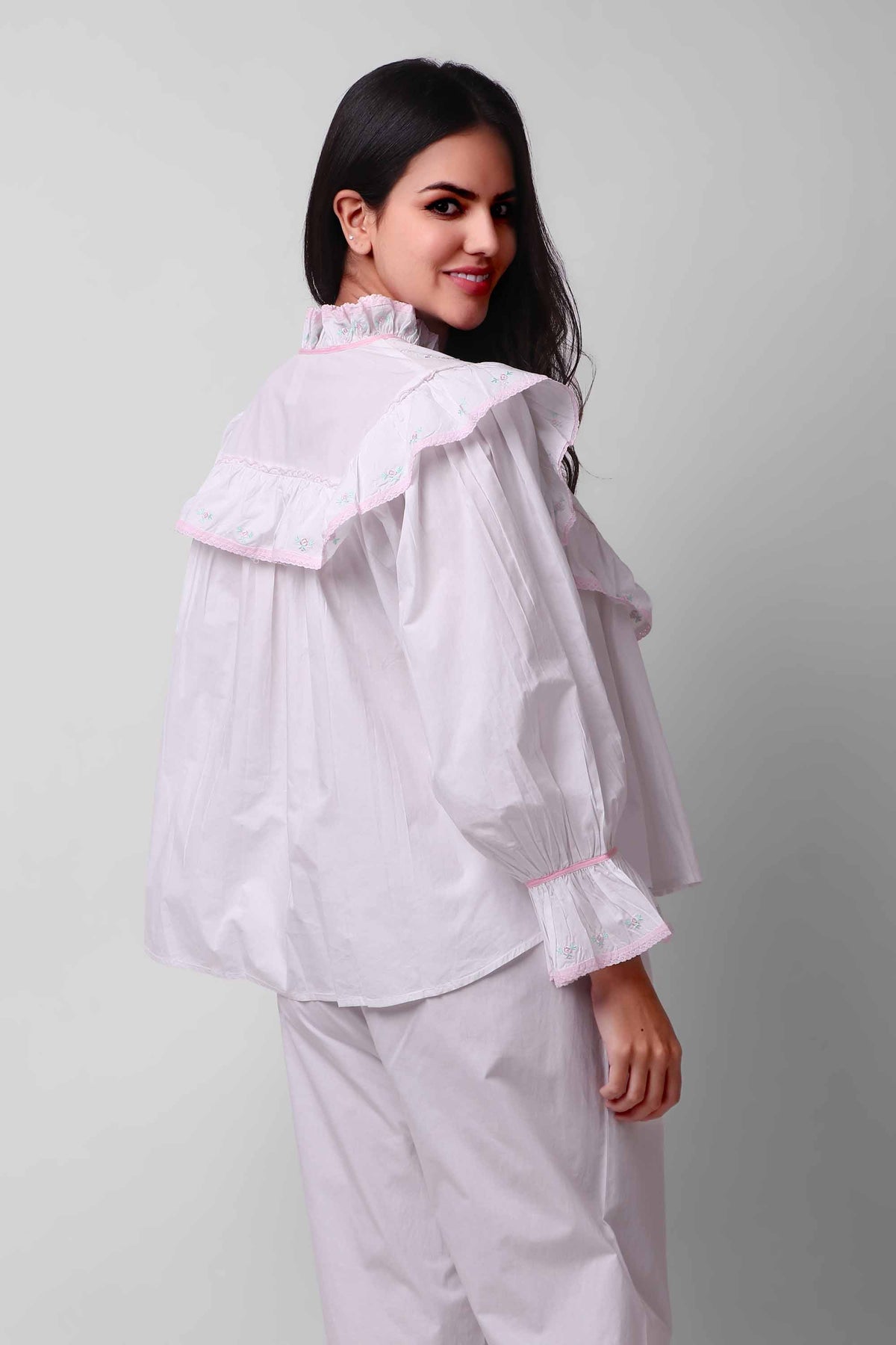 Elegant Mary Pyjama Suit with ruffled design and floral embroidery.