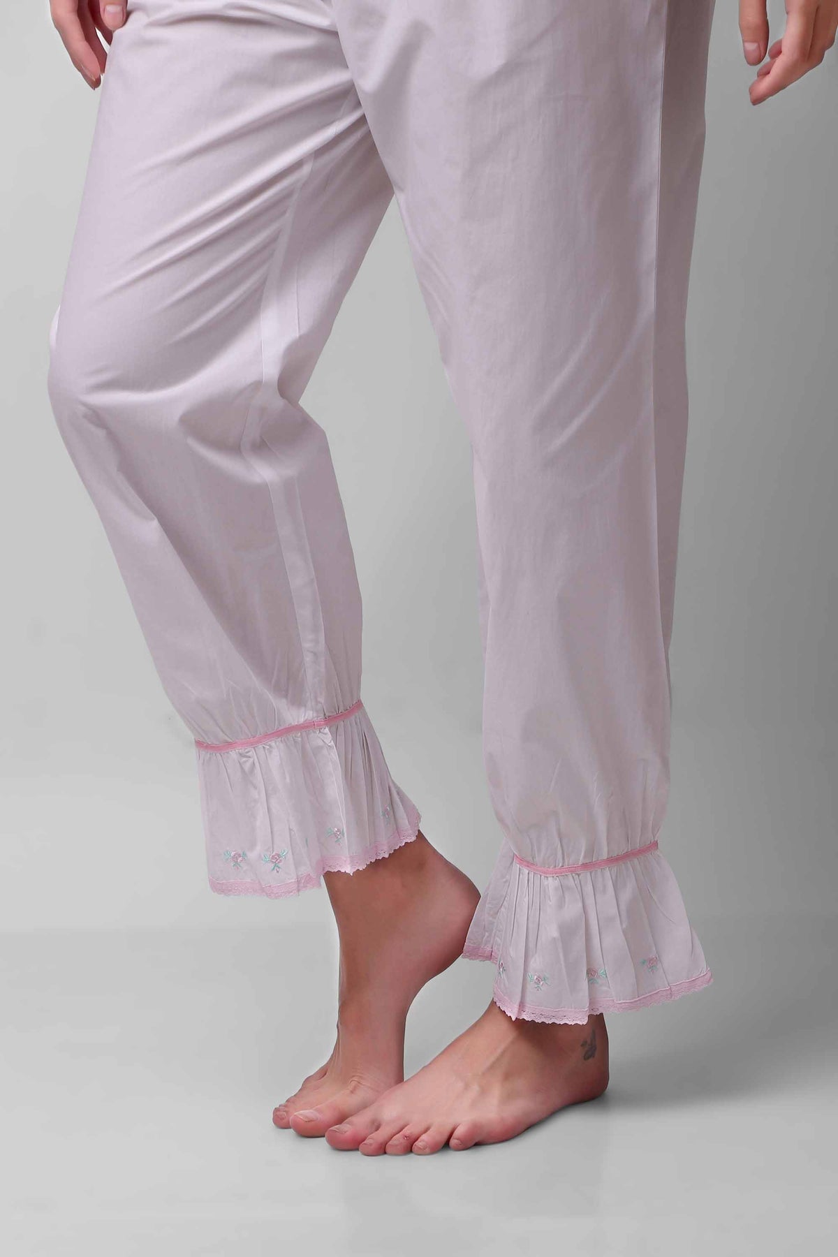 Mary Pyjama Suit featuring delicate lace trim and soft fabric.