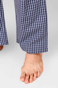 Men's pyjama suit with checkered blue pattern and relaxed fit.