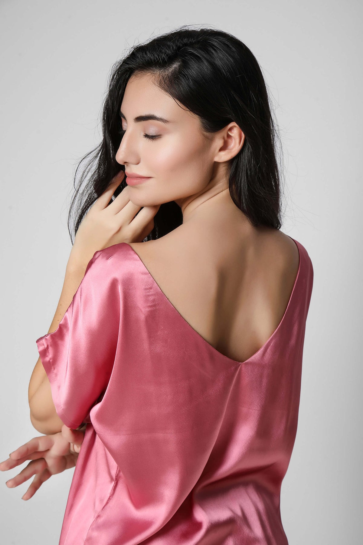 Model wearing Roxxy pink satin net shorts and top.