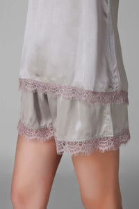 Elegant satin cami and shorts set with lace trim.