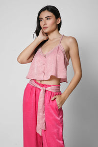 Pink cropped top and matching trousers set for women.