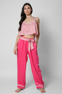Women's stylish pink Queen Set sleepwear with matching top and pants.