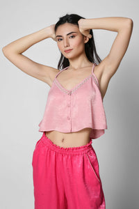 Model wearing a pink Queen set with stylish cropped top.