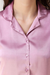 Dani Pyjama Suit in luxurious satin pink with stylish collar and buttons.