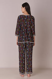 Reva Pyjama Suit floral design, back view, comfortable loungewear.