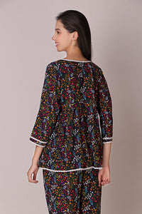 Reva Pyjama Suit with vibrant floral print, perfect for relaxation.