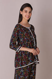 "Reva Pyjama Suit featuring vibrant floral patterns and stylish design."