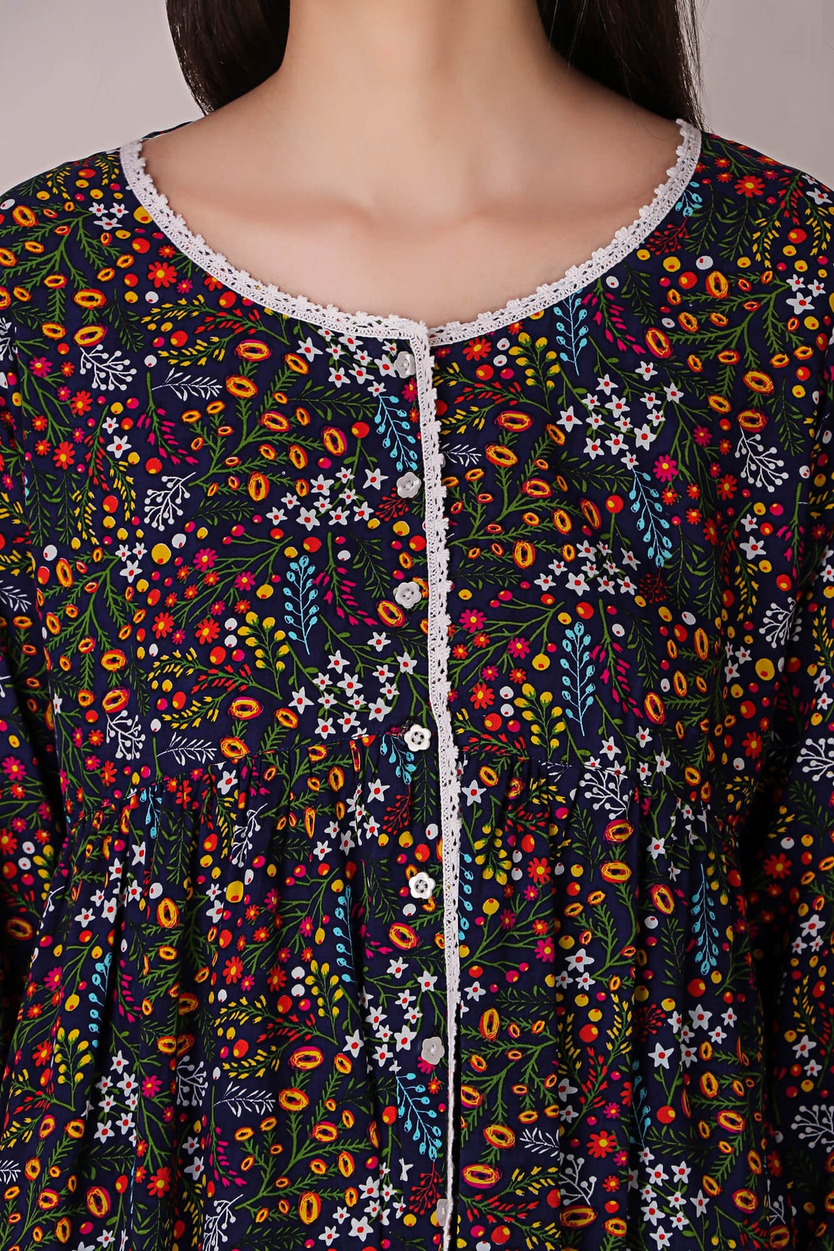 Reva Pyjama Suit with colorful floral print and lace detailing.
