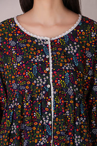 Reva Pyjama Suit with colorful floral print and lace detailing.