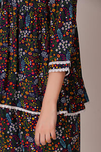 Colorful floral Reva pyjama suit with lace trim details.