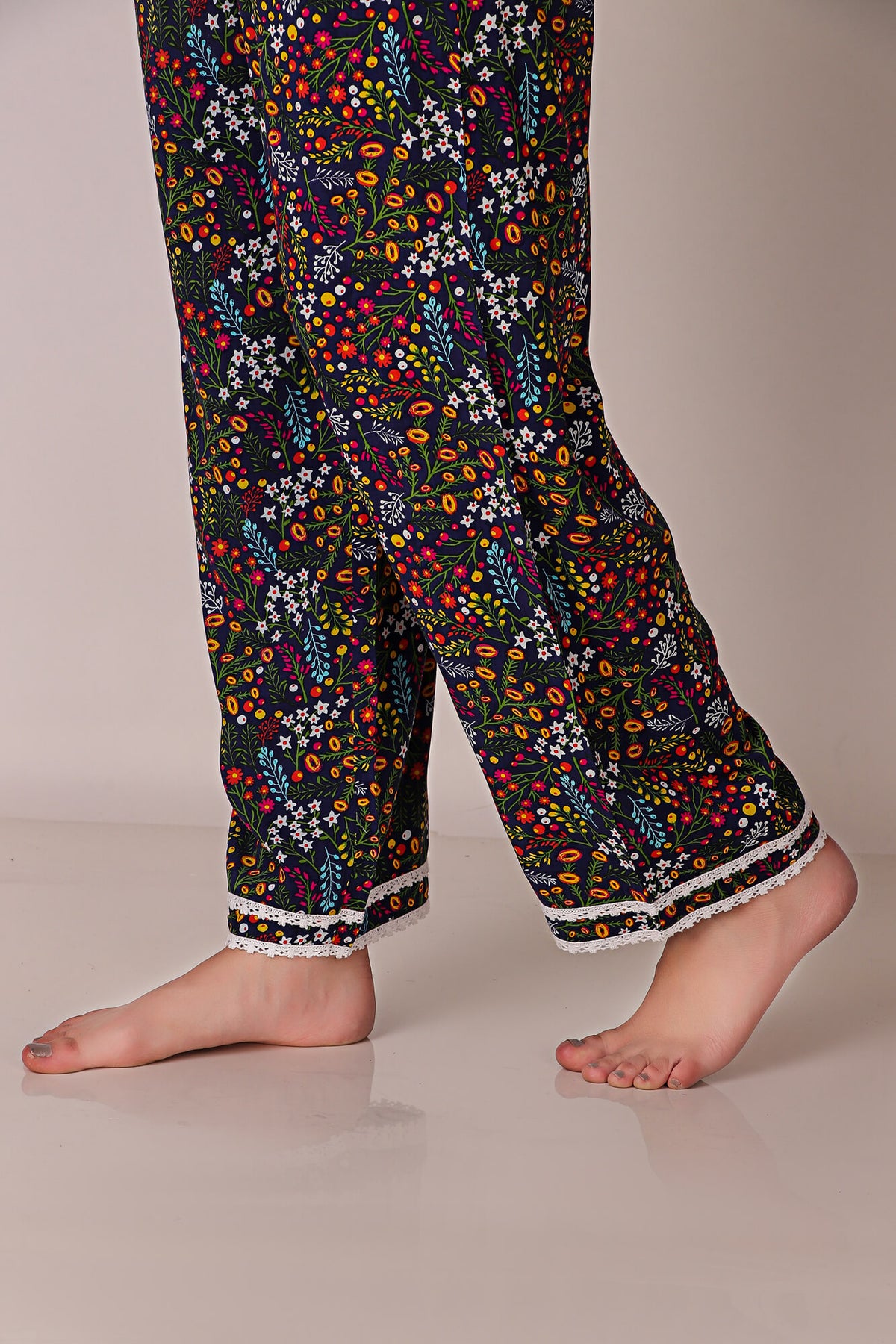 Colorful floral patterned Reva Pyjama Suit with lace trim.