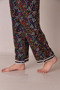 Colorful floral patterned Reva Pyjama Suit with lace trim.