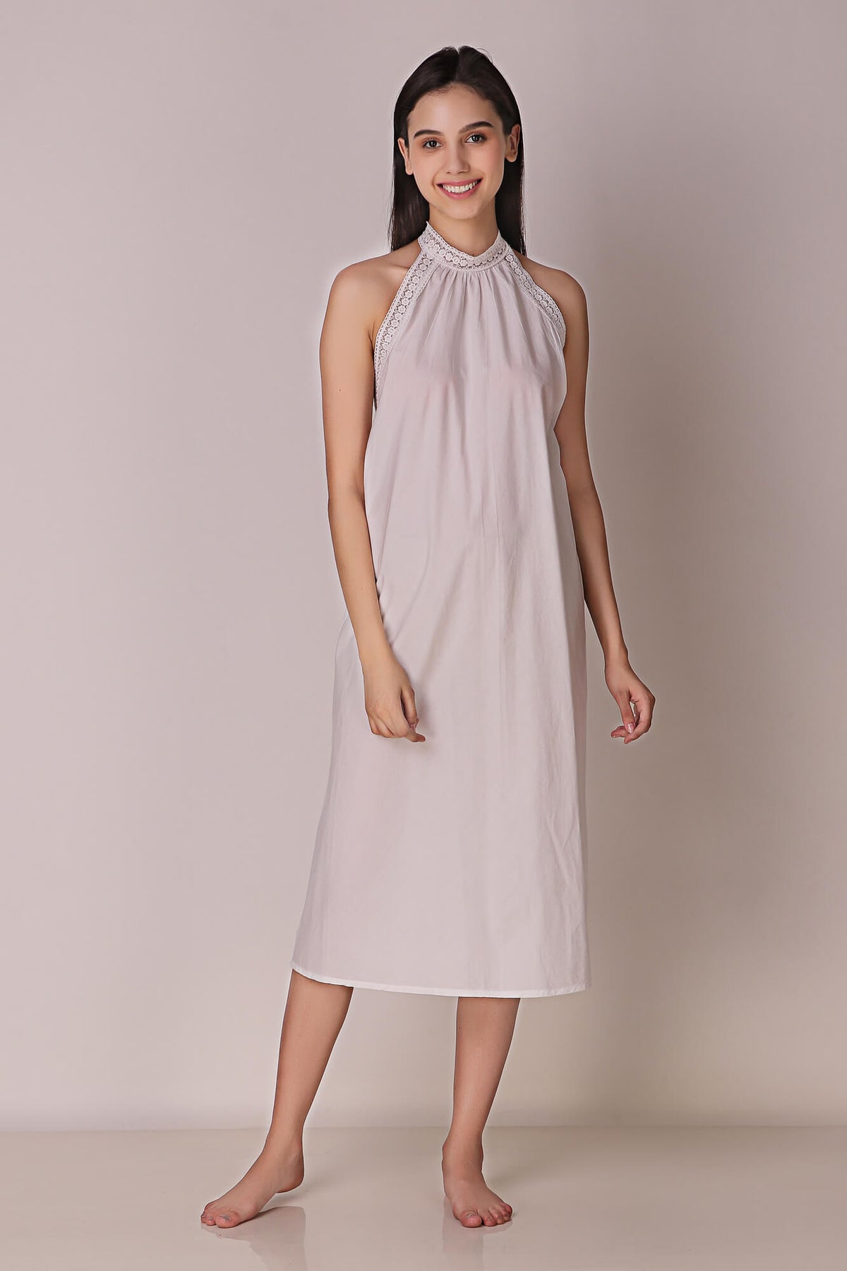 Model wearing Talisa backless dress in elegant pose.
