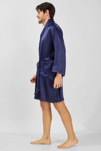 Man wearing a navy satin robe, showcasing style and comfort.