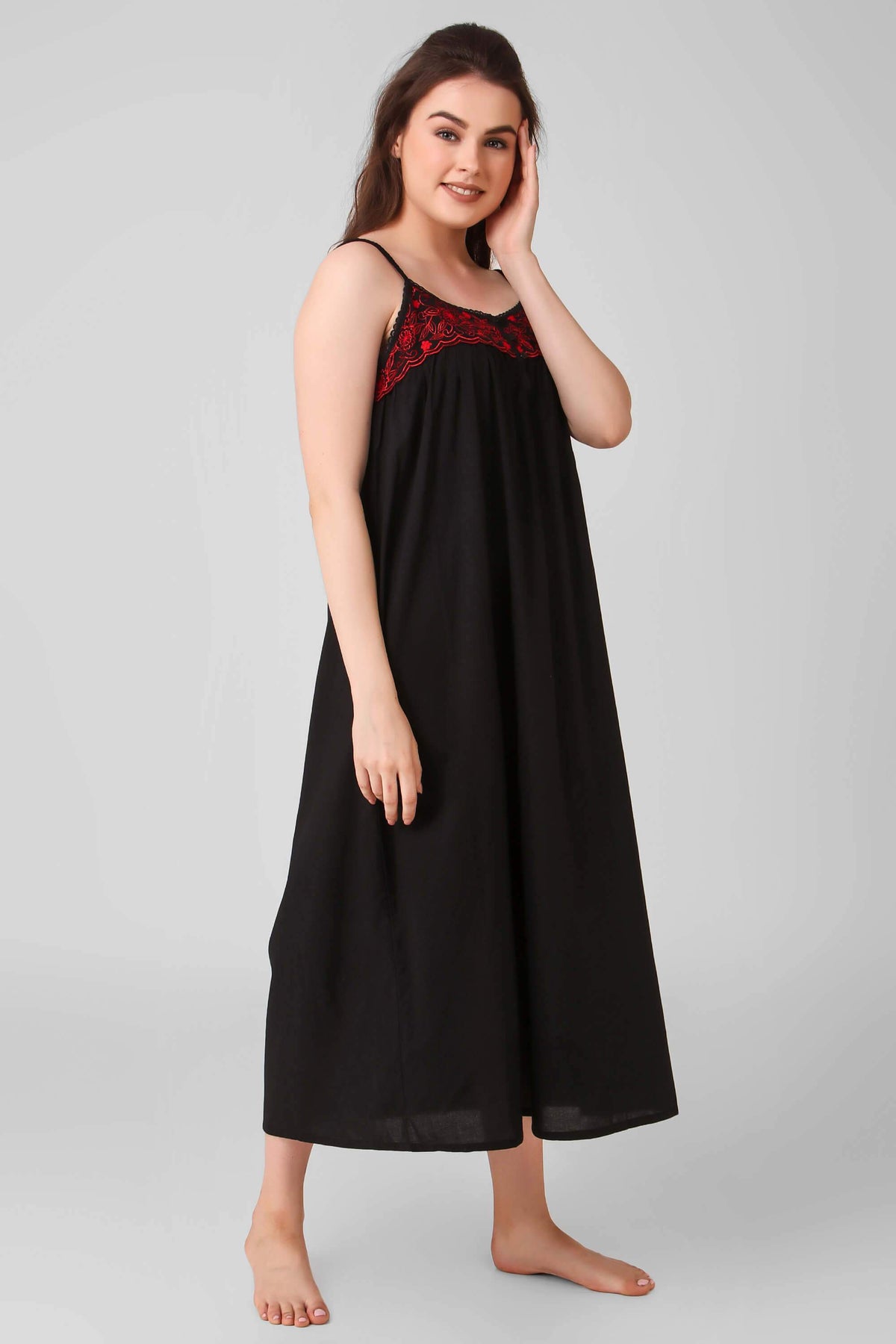 Black dress with red embroidery, featuring a stylish bolero shrug.