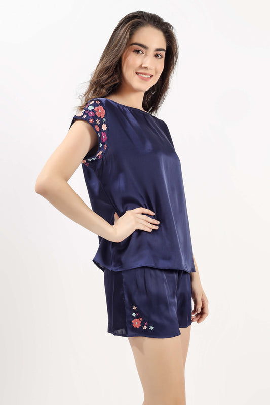Elegant navy shorts and top set with floral embroidery.