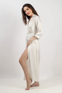 Model wearing Gen embroidered gown with floral design and elegant silhouette.