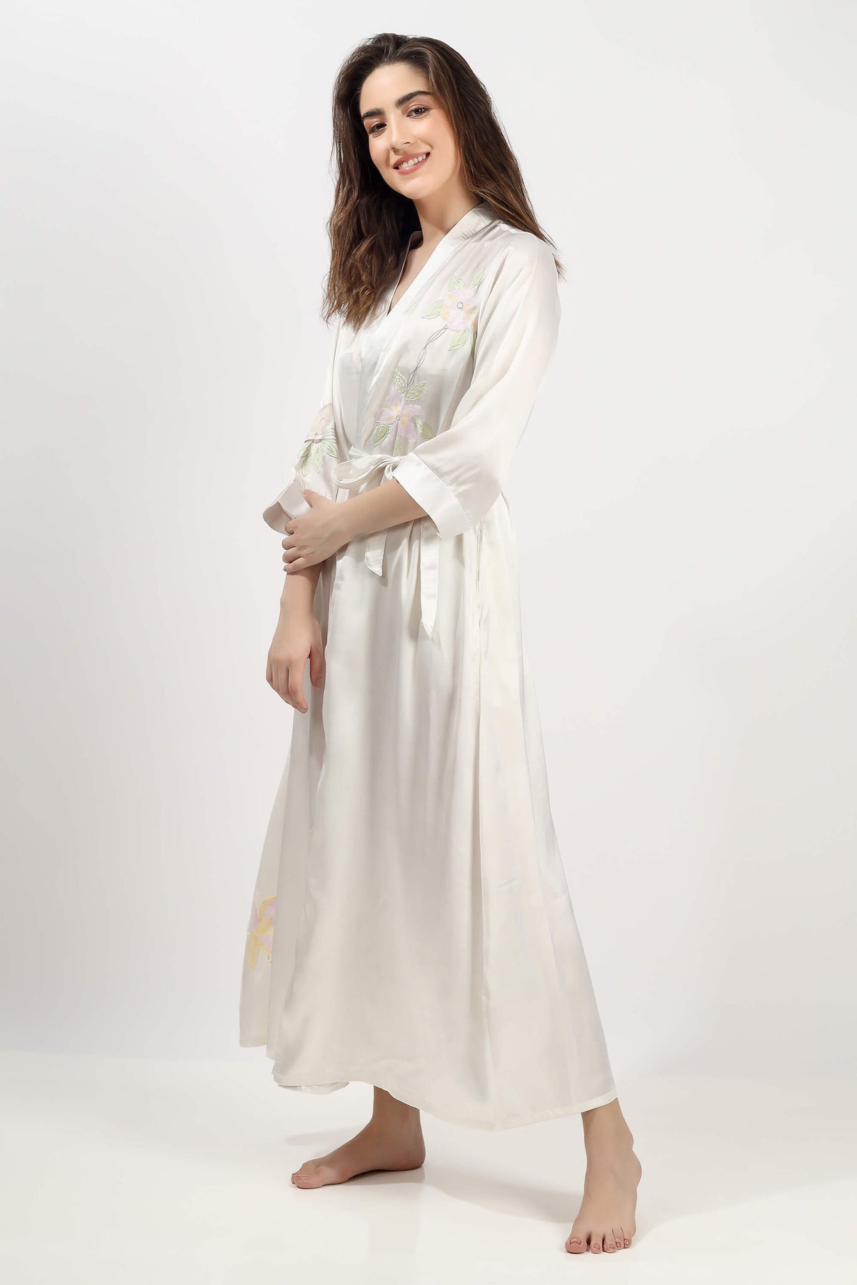 Elegant Gen embroidered gown in soft fabric with floral details.
