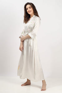 Elegant Gen embroidered gown in soft fabric with floral details.