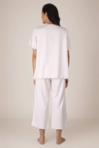 Rear view of Cory Pyjama Suit in soft pink fabric.