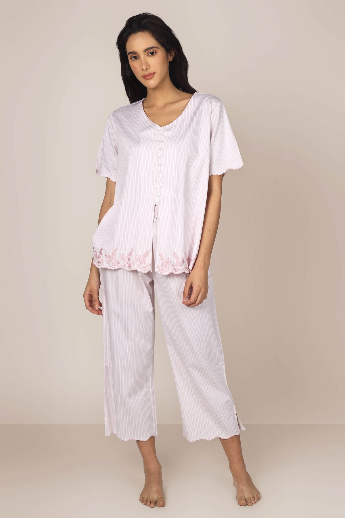 Cory pyjama suit featuring soft fabric and elegant floral detailing.