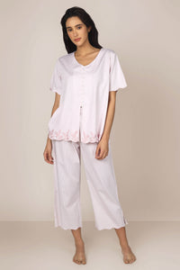 Cory pyjama suit featuring soft fabric and elegant floral detailing.