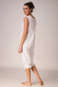 White Enola romper featuring lace detailing and a relaxed fit.