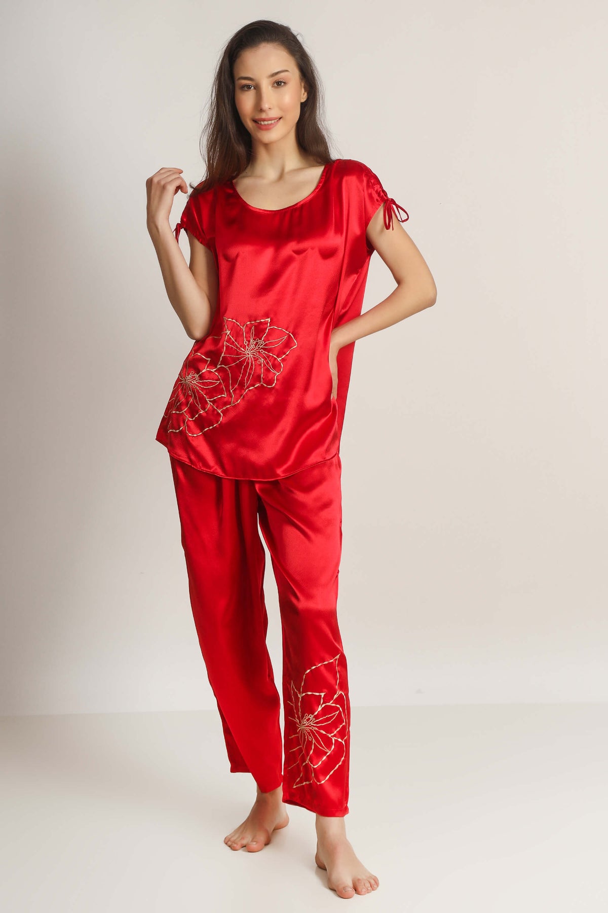 Red satin pyjama suit with floral embroidery, elegant and stylish design.